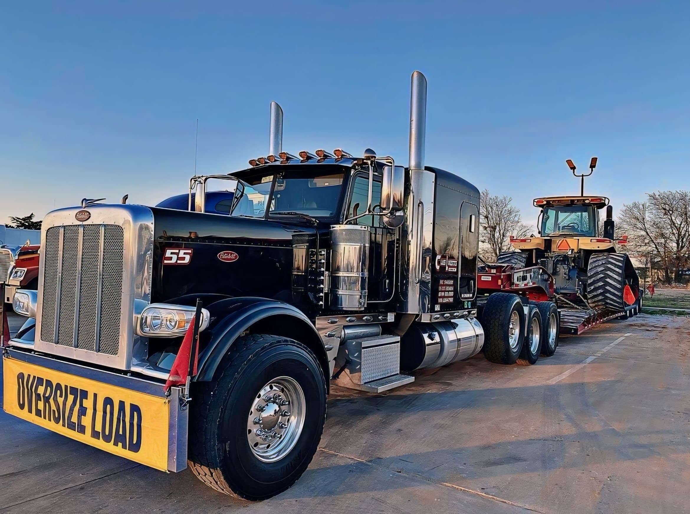 Class Global Logistics truck hauling construction equipment